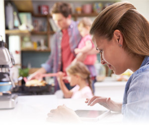 womean using tablet in kitchen